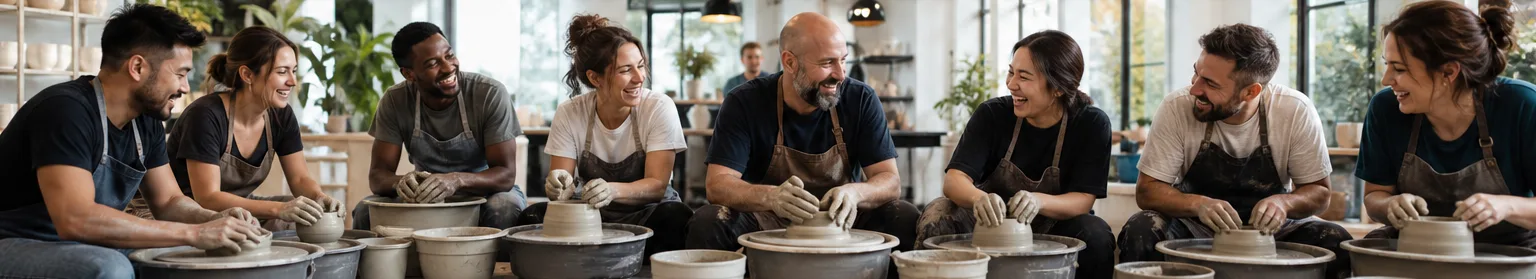 A group enjoying a private pottery team building event in a studio